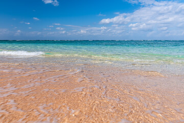 Stunning turquoise crystal clear sea water at a paradise beach in a sunny day.