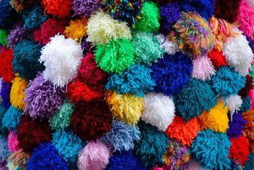 
Decorative colored pompoms made of threads