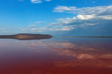 Red salt lake with a blue sky in the Crimea