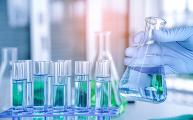Hand of scientist with test tube and flask in medical chemistry lab, Laboratory research