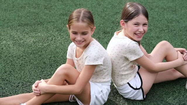 sisterhood. two sisters or friends spending time outdoors on sunny summer day. bff, sibling, girlfriend. millennial teen.