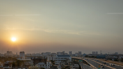 Panorama view of city landscape of modern skyscraper building and office tower in business district during sunset in the evening with clear blue sky. Bangkok metropolitan, capital city of Thailand.