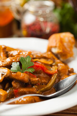 Boeuf, Stroganow, Strogonow. Classic, Russian beef stew. Served on a white plate. Front view. Natural background.