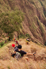 Obraz premium a group of people walking on the trek