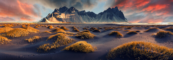 Scenic image of famous Stokksnes cape and Vestrahorn Mountain with  colorful dramatic sky during sunset in Iceland. Iconic location for landscape photographers. Amazing nature of World. - obrazy, fototapety, plakaty