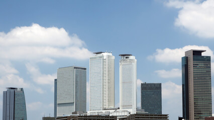 Naklejka premium Japanese high-rise building and blue sky(tower condominium,skyscraper,urban landscape)