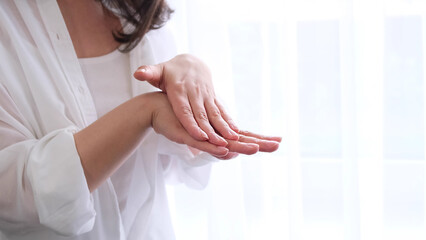 Closeup shot of hands applying moisturizer. Treat yourself. Young lady try moisturizing...