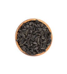 Top view of wooden bowl full of unshelled sunflower seeds over white background.