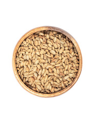 Wooden bowl full of peeled sunflower seeds on a white background.