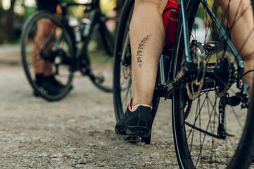 Cropped shot of a bicycle chain greasy mark on a woman leg