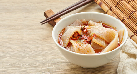hot pot Sichuan noodles in white bowl on wooden table background. hot pot Sichuan noodles in white plate Chinese food background                                                                        