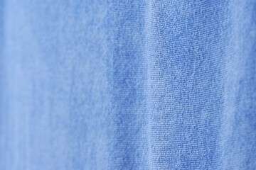 Blurry blue texture of a fabric for background backdrop 