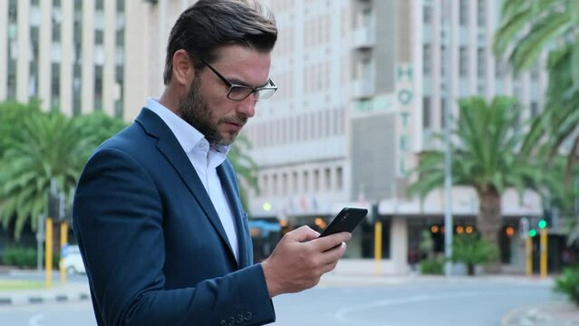 Stressed dissatisfied American businessman reading letter with bad news, unexpected debt, bank or job dismiss notification. american businessman in suit on wall street reading bad news on phone