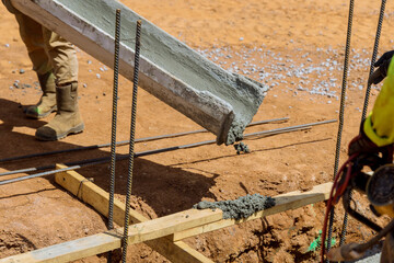 In the construction of a house, trenches are poured to serve as foundation in construction site