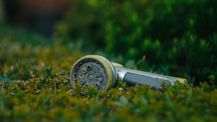 watering can on grass