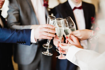 Gorgeous wedding couple enjoys champagne in the ceremony