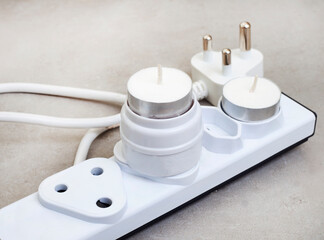 electricity multiplug for when there is power and when there is not. multi plug with candles for...