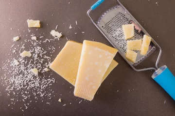 Fotobehang Directly above shot of cheese with grater on table, copy space © wavebreak3