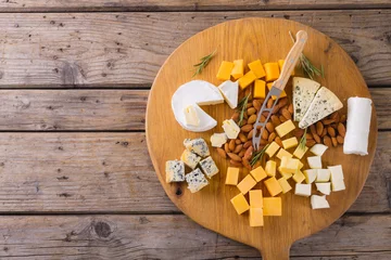 Gardinen Directly above shot of various cheese with knife and almonds on table, copy space © WavebreakMediaMicro
