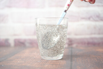 close up of chia seeds in a glass of water 
