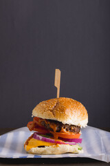 Close-up of burger against gray background with copy space