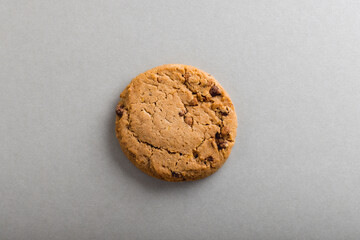 Overhead view of cookie on gray background with copy space