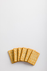 Overhead view of crackers on white background with copy space