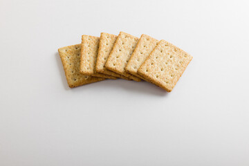 High angle view of crackers on white background with copy space