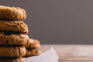 Close-up of cookies stacked against gray background, copy space