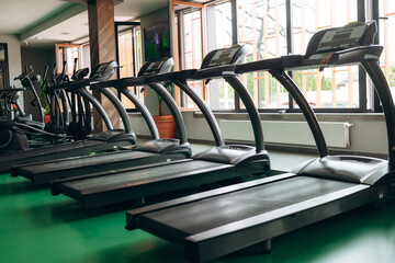 treadmills in gym. Concept of sport and healthy lifestyle