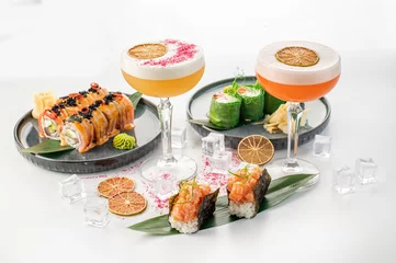 Foto op Plexiglas Set of different sushi rolls and cocktails on white background © rostyslav84