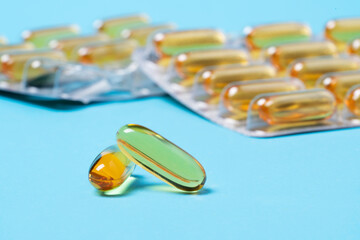 Blister of omega vitamin D transparent tablets. Witamin D stimulates the absorption of calcium and...