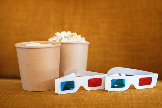 3D glasses with popcorn on couch