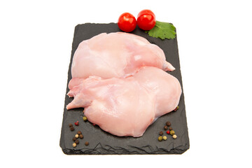 Raw rabbit thigh meat on a cutting board. Isolate.