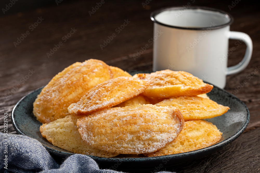 Wall mural traditional madeleines with sprinkled sugar.