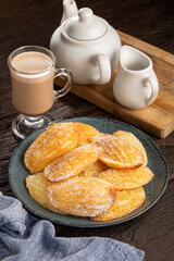 Traditional madeleines with sprinkled sugar.
