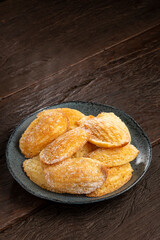 Traditional madeleines with sprinkled sugar.