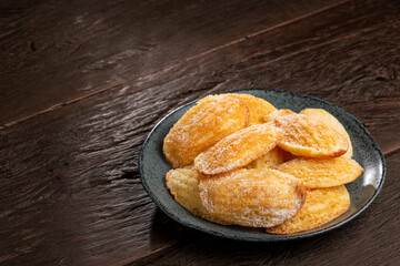 Traditional madeleines with sprinkled sugar.