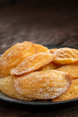 Traditional madeleines with sprinkled sugar.