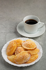 Traditional madeleines with sprinkled sugar.