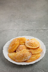 Traditional madeleines with sprinkled sugar.