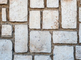Texture photo of a random sized bricks rough masonry