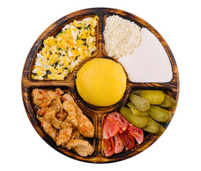 Traditional Moldavian hominy porridge on a wooden tray