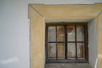 Fototapeta na wymiar Wooden window in a rustic home