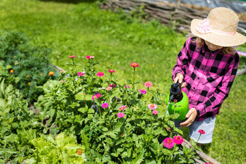 Portrait of a girl working in the garden on holiday