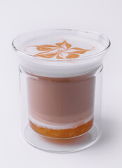 Glass of delicious latte macchiato isolated on white