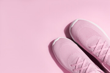 Pink sport sneakers on pink background - 521234789