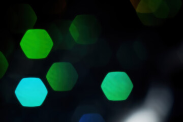 Large hexagon green bokeh on black background for overlay
