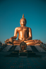 Big Buddha during sunset at Wat Muang in Ang Thong, Thailand