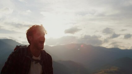 Happy traveler hike mountains closeup. Young tourist reach peak on nature sunset